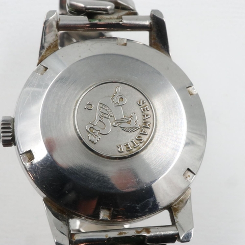 65 - OMEGA: Seamaster gents steel cased automatic wristwatch on an expanding bracelet, working at lotting... 