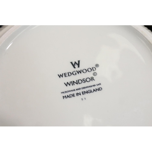 106 - Wedgwood dinnerware of eight pieces in the Windsor pattern, including serving dishes, tea pot, salad... 