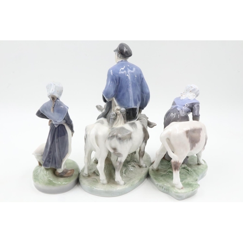 165 - Three Royal Copenhagen figural groups, no. 528 Goose Girl, 779 Girl Feeding, a calf and 1858 man wit... 