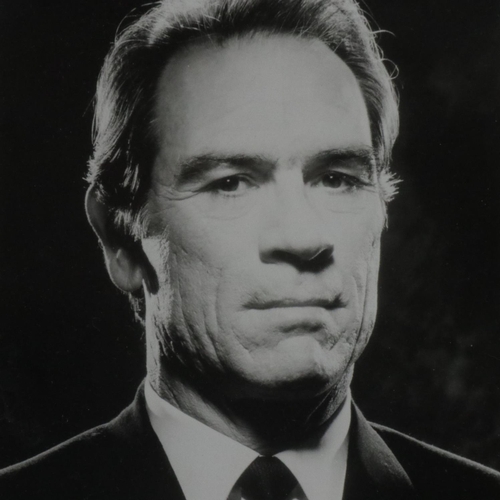 266 - Tommy Lee Jones publicity shot with an autographed one-dollar note, framed with CoA. Not available f... 