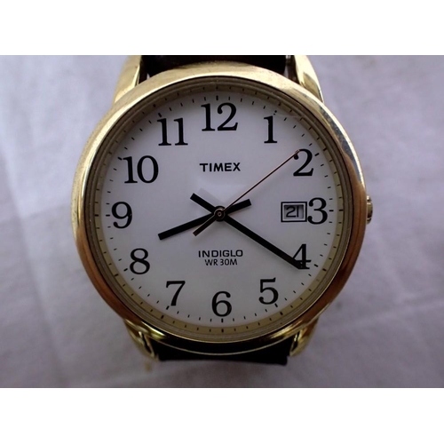 1111 - Timex Indiglo gents wristwatch, with date aperture and leather strap, working at lotting up, new bat... 