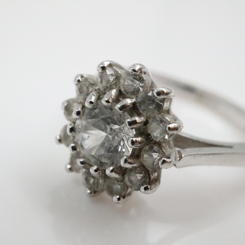 12 - 18ct white gold cocktail ring with central 0.5cts diamond surrounded by twelve smaller diamonds, siz... 