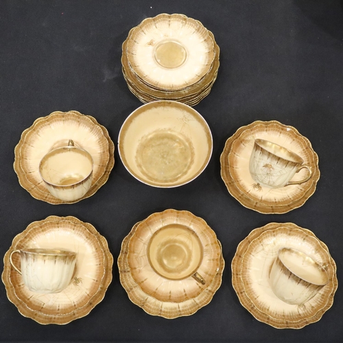 119 - Limoges tea service in the toiles d'araignées pattern, with cream and gold ground decorated with spi... 