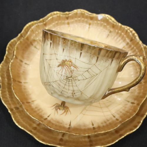 119 - Limoges tea service in the toiles d'araignées pattern, with cream and gold ground decorated with spi... 