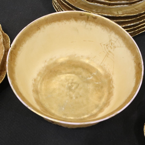 119 - Limoges tea service in the toiles d'araignées pattern, with cream and gold ground decorated with spi... 