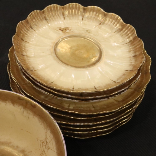 119 - Limoges tea service in the toiles d'araignées pattern, with cream and gold ground decorated with spi... 