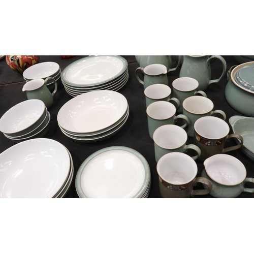 129 - Denby dinner and coffee service of thirty-nine pieces in the Regency Green colourway. Not available ... 
