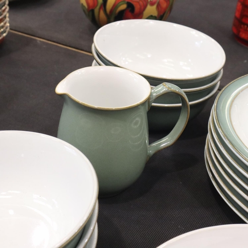 129 - Denby dinner and coffee service of thirty-nine pieces in the Regency Green colourway. Not available ... 