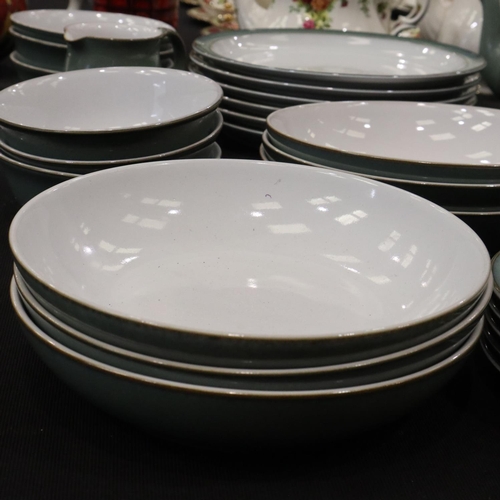 129 - Denby dinner and coffee service of thirty-nine pieces in the Regency Green colourway. Not available ... 
