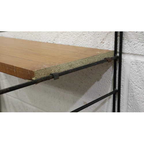 2012 - Mid 20th century modular bookcase in the manner of Ladderrax, comprising six upright supports and sh... 