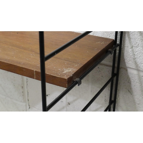 2012 - Mid 20th century modular bookcase in the manner of Ladderrax, comprising six upright supports and sh... 