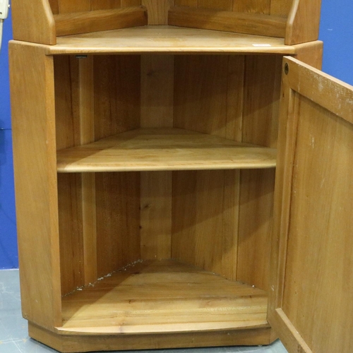 2014 - Ercol elm floor standing corner cupboard, illuminated open shelves above a single door cupboard. Not... 