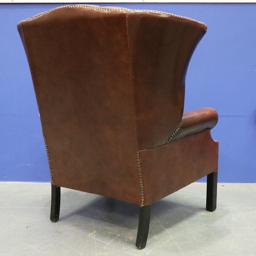 2024 - A modern Chesterfield brown leather gentleman's fireside wing-back armchair. Not available for in-ho... 