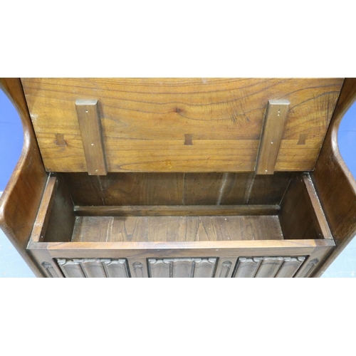 2028 - A 20th century carved oak monk's bench or settle in the 17th century gothic style, with hinged box-s... 