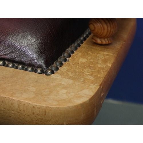 2029 - A modern light elm framed desk chair in the Chesterfield style, revolving and supported on a five-sp... 