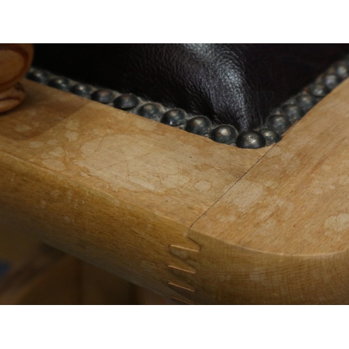 2029 - A modern light elm framed desk chair in the Chesterfield style, revolving and supported on a five-sp... 