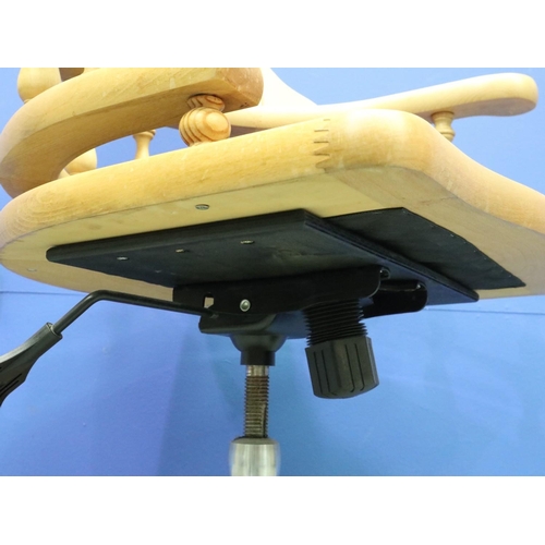 2029 - A modern light elm framed desk chair in the Chesterfield style, revolving and supported on a five-sp... 