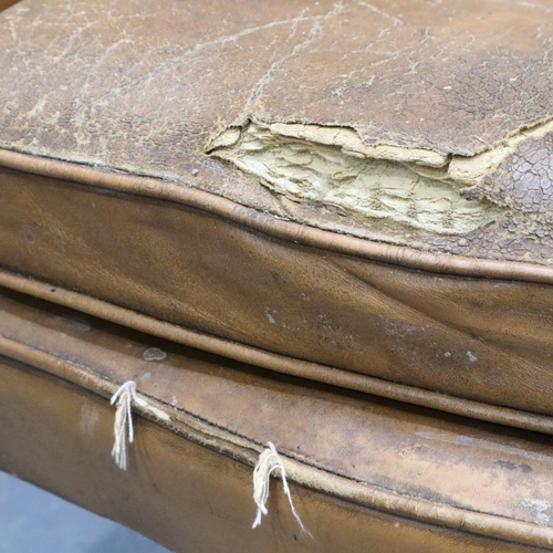 2033 - Early 20th century distressed tan leather Chesterfield wingback fireside armchair. Not available for... 