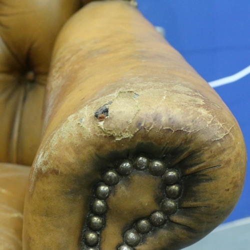 2033 - Early 20th century distressed tan leather Chesterfield wingback fireside armchair. Not available for... 