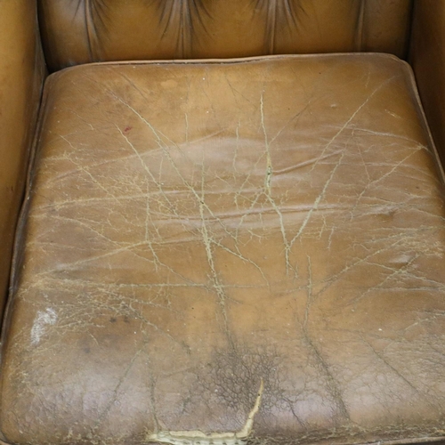 2033 - Early 20th century distressed tan leather Chesterfield wingback fireside armchair. Not available for... 
