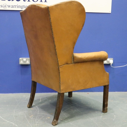 2033 - Early 20th century distressed tan leather Chesterfield wingback fireside armchair. Not available for... 