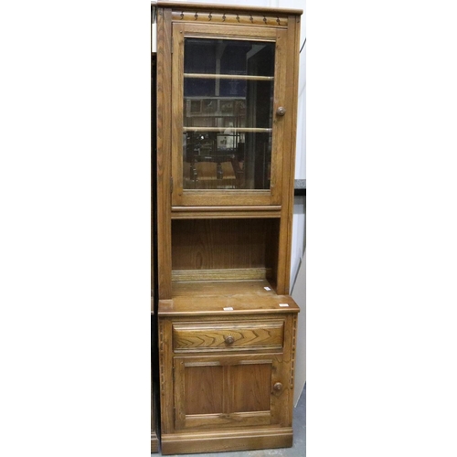 2040 - Ercol Golden Dawn elm bookcase with glazed and panelled cupboard doors. Not available for in-house P... 