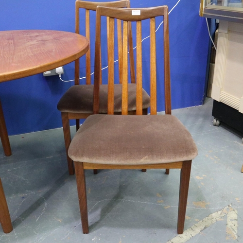 2041 - Leslie Dandy designed for G Plan, a set of four teak framed dining chairs, with an oval extending te... 