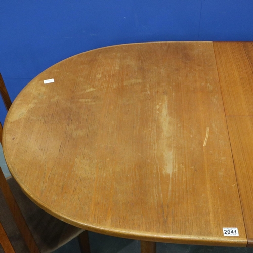 2041 - Leslie Dandy designed for G Plan, a set of four teak framed dining chairs, with an oval extending te... 