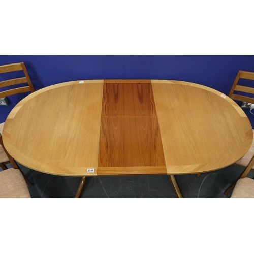 2046 - Nathan oval extending dining table, with a set of four upholstered dining chairs. Not available for ... 