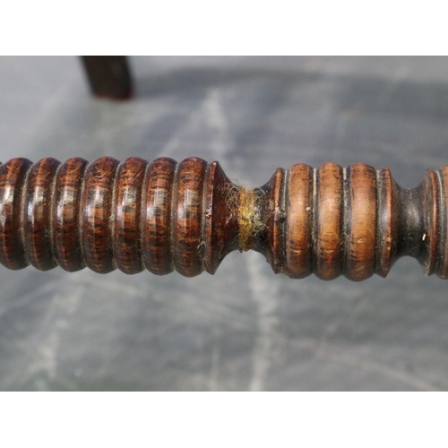 2048 - A pair of Regency period rosewood elbow chairs, each having bergère seats, with turned supports and ... 