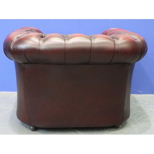 2049 - A Chesterfield club armchair in ox-blood red leather. Not available for in-house P&P