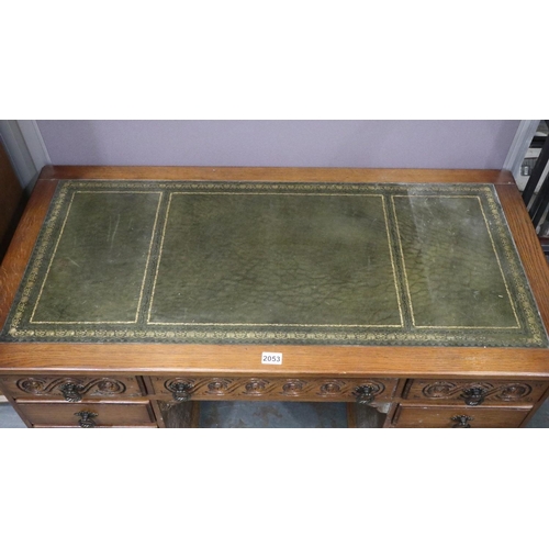 2053 - 20th century oak twin pedestal writing desk, twin pedestal with carved detail to top-drawer facias a... 