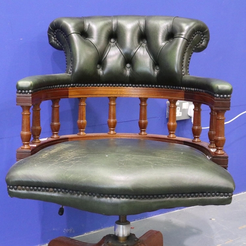 2056 - 20th century green leather captains style desk chair, on five-spoke swivel base, studded and buttone... 