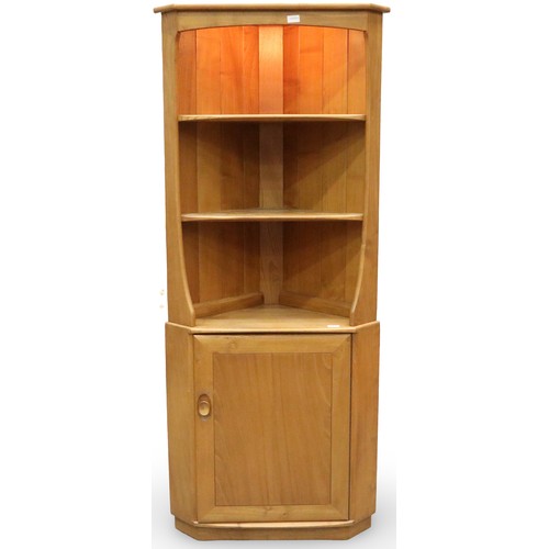 2014 - Ercol elm floor standing corner cupboard, illuminated open shelves above a single door cupboard. Not... 
