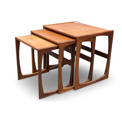 2015 - G-Plan nest of three graduating teak tables, largest 54 x 44 x 49cmH. Some marks, fading and surface... 