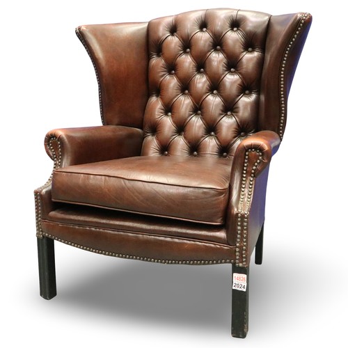 2024 - A modern Chesterfield brown leather gentleman's fireside wing-back armchair. Not available for in-ho... 