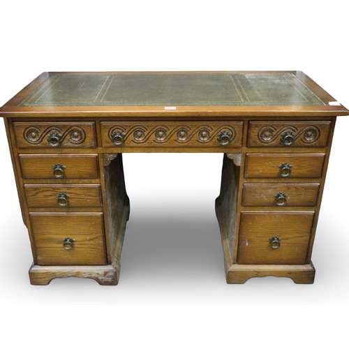 2053 - 20th century oak twin pedestal writing desk, twin pedestal with carved detail to top-drawer facias a... 