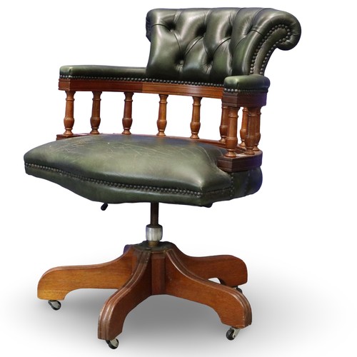 2056 - 20th century green leather captains style desk chair, on five-spoke swivel base, studded and buttone... 