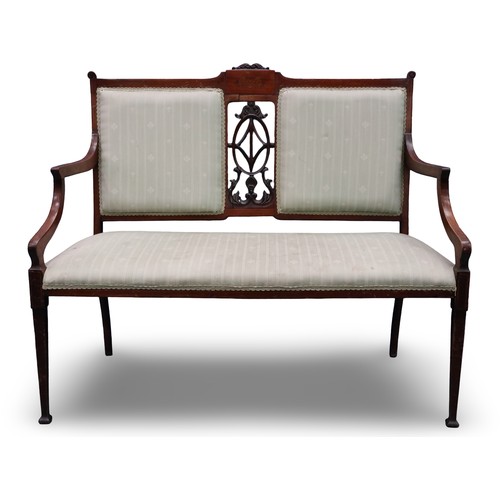2025 - An Edwardian two-seat settee, inlaid walnut frame with upholstered and carved backrest, raised on ta... 
