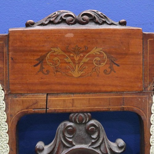 2025 - An Edwardian two-seat settee, inlaid walnut frame with upholstered and carved backrest, raised on ta... 