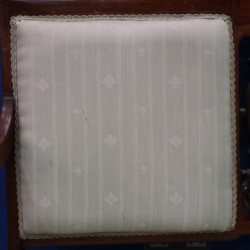 2025 - An Edwardian two-seat settee, inlaid walnut frame with upholstered and carved backrest, raised on ta... 