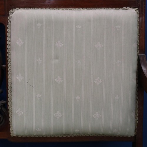 2025 - An Edwardian two-seat settee, inlaid walnut frame with upholstered and carved backrest, raised on ta... 