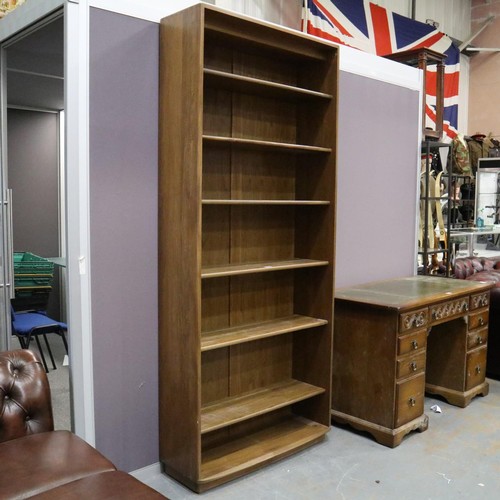2054 - Ercol Golden Dawn elm bookcase having six fixed shelves. Not available for in-house P&P