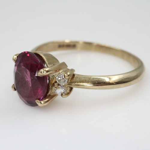 39 - 9ct gold fire garnet and diamond set ring, size O, 2.6g. UK P&P Group 0 (£7+VAT for the first lot an... 