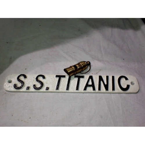 1070 - Cast iron Titanic whistle and cast iron S.S Titanic sign, W: 30 cm. UK P&P Group 2 (£24+VAT for the ... 