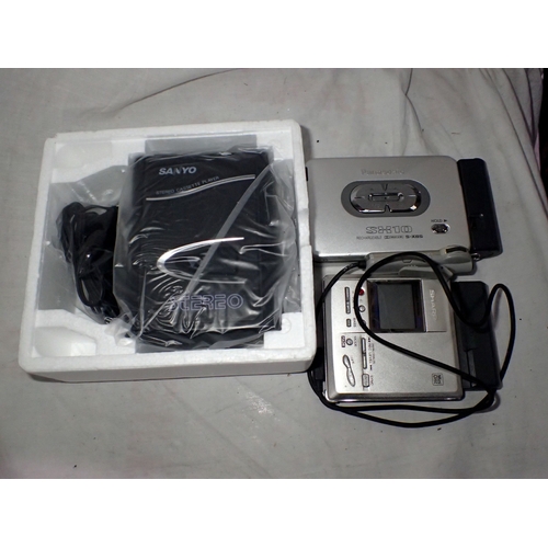 1107 - A Sharp minidisc walkman and two portable cassette players, a Panasonic and a boxed Sanyo. UK P&P Gr... 