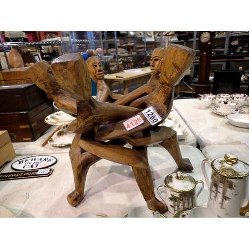1260 - African five head figural carved wooden table base. Not available for in-house P&P