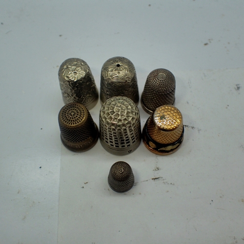 1059 - Seven mixed thimbles including silver. UK P&P Group 1 (£18+VAT for the first lot and £2+VAT for subs... 