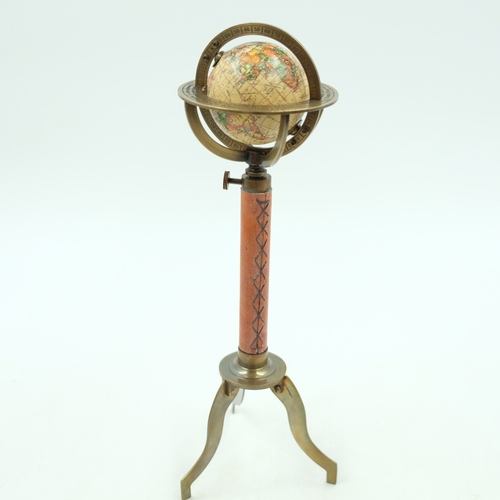 252 - Small world globe on leather and brass stand, H: 30 cm.  UK P&P Group 1 (£18+VAT for the first lot a... 