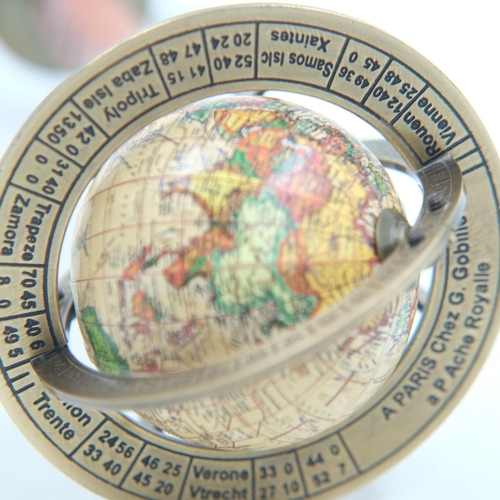 252 - Small world globe on leather and brass stand, H: 30 cm.  UK P&P Group 1 (£18+VAT for the first lot a... 